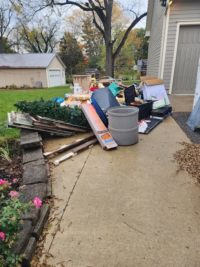 Dumpster being loaded with debris for 10 Yard Dumpster Rental in West Carson